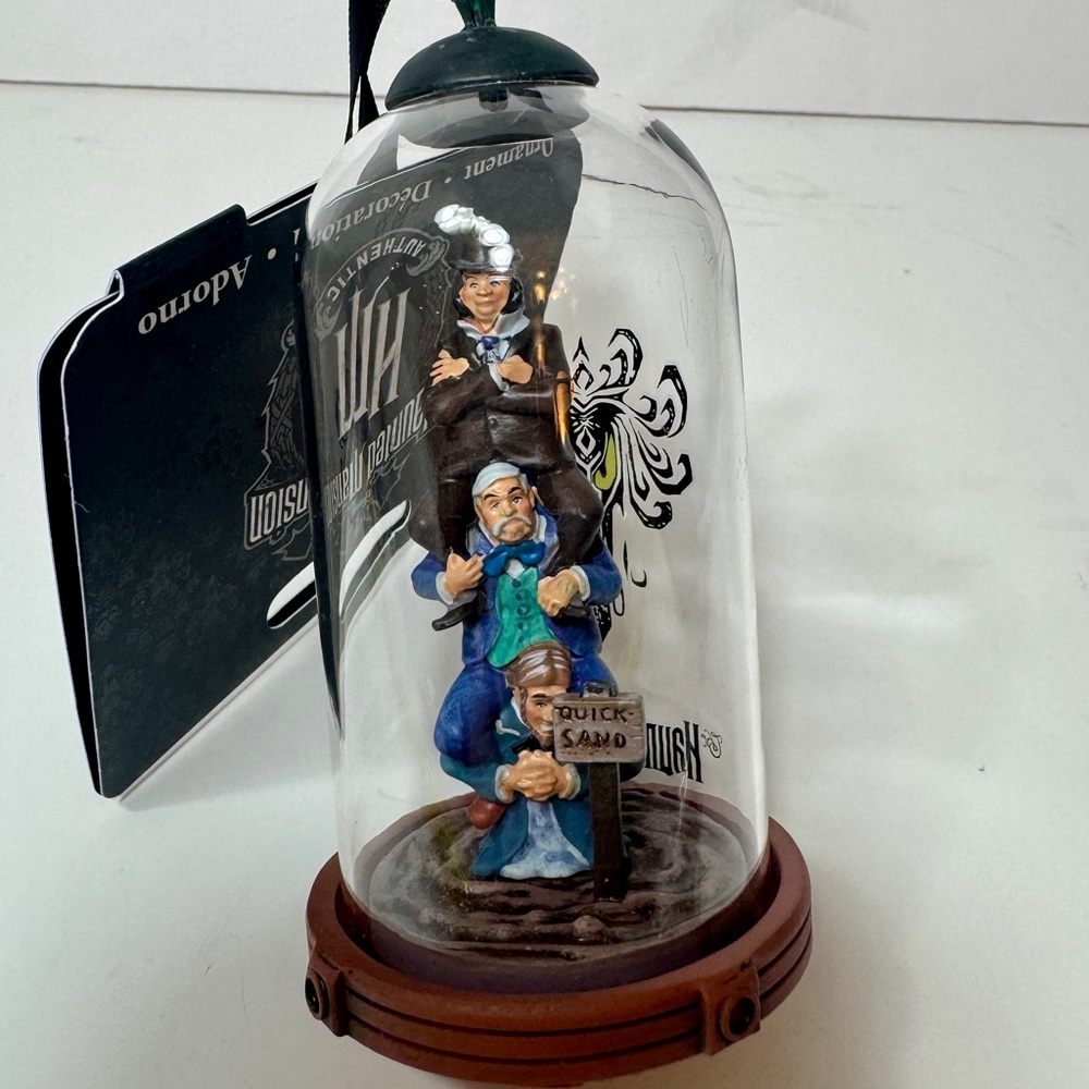 NWT. Disney Parks Sketchbook Ornament featuring the three "quicksand men"